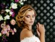 beautiful sexy blonde bride.posing in wedding dress on wedding flower arch