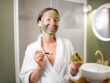 Woman with facial mask and patches in the bathroom